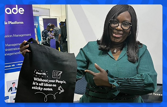 Dayo Abatan with our merch at the HREA Expo